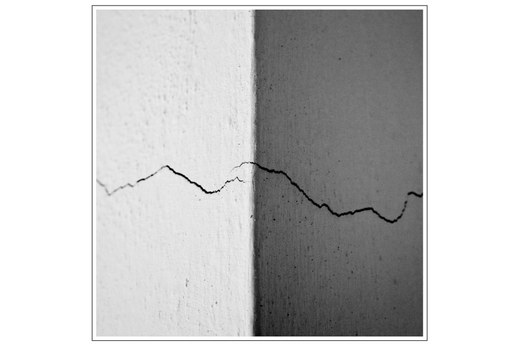 Cracks in our walls. Shows the offense causes division. 