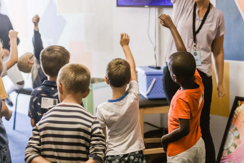 Children playing team building classroom activities 