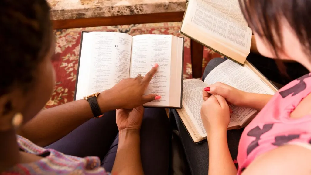 women reading Bible and doing affirmations