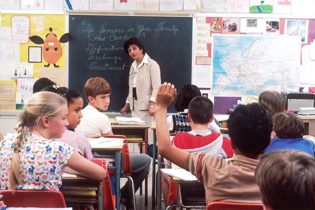 female teacher teaching children