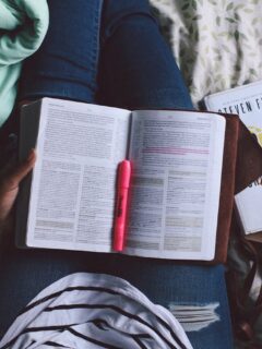person holding unfold book