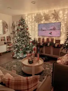 Festive Christmas living room decorated with a Christmas tree, string lights, and holiday ornaments, cozy holiday decor.