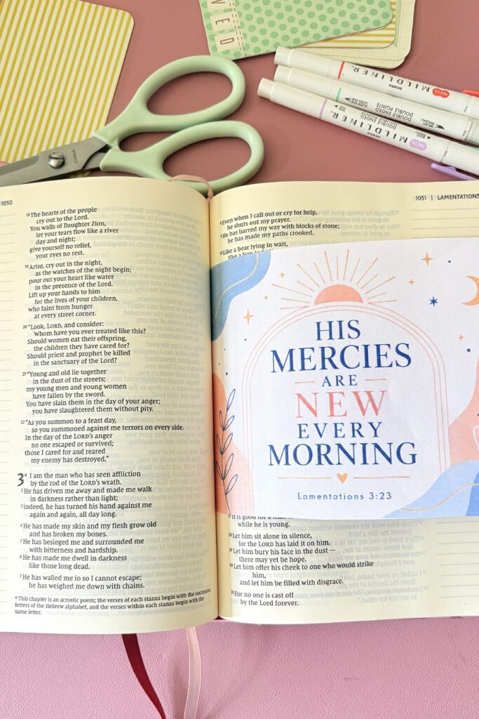Bible journal with colorful illustrations and open pages, emphasizing hope and renewal.