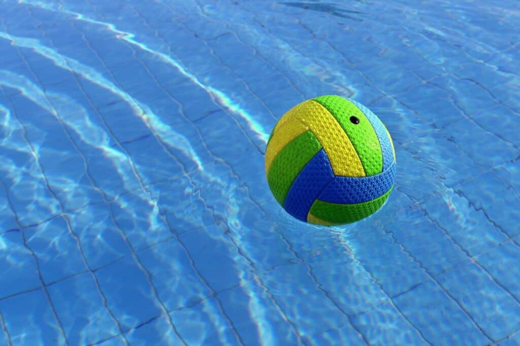 A colorful ball floats on the water.