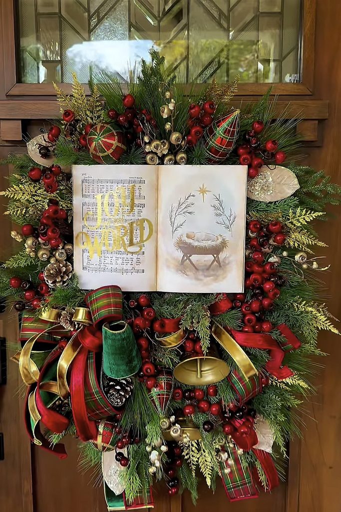Festive Christmas wreath with nativity scene, ornaments, and ribbons for holiday decor.